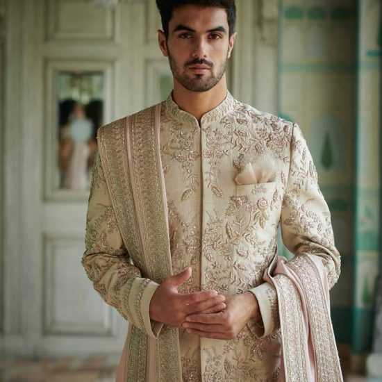 With a kingly vibe around, an Ivory sherwani made…